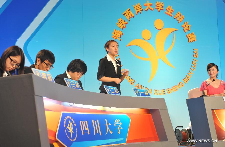 Students from Sichuan University compete in the 14th Cross-Strait University Debate Contest in Fuzhou, capital of southeast China's Fujian Province, July 20, 2015.
