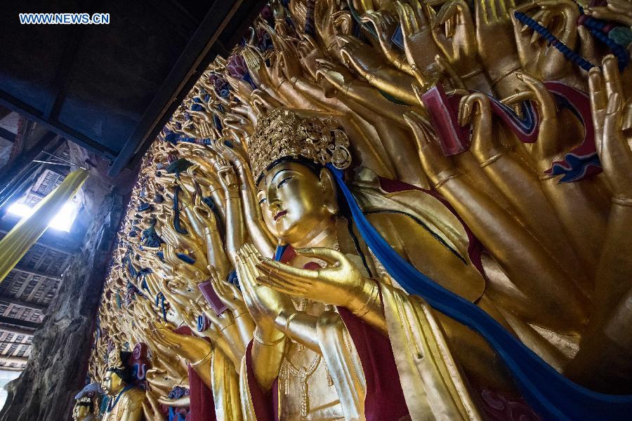 The statue with gold foil, carved in the